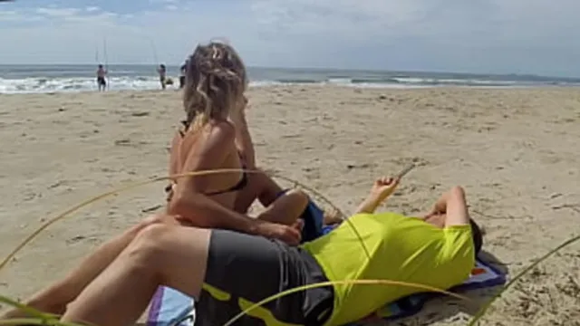 Hot milf seduces stranger with intense handjob by the shore