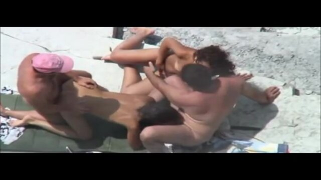 Hot couples swing and smash on the beach